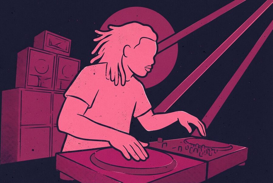 a dj over the decks beside a speaker stack, beams cutting across