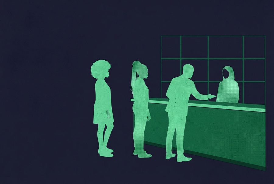 an orderly line at a sign in desk in the evening