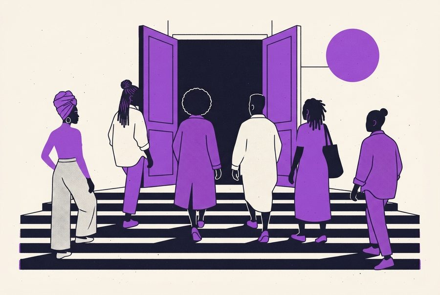 people walking up broad steps to open foyer doors in the afternoon